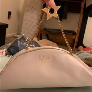 White Dior makeup bag